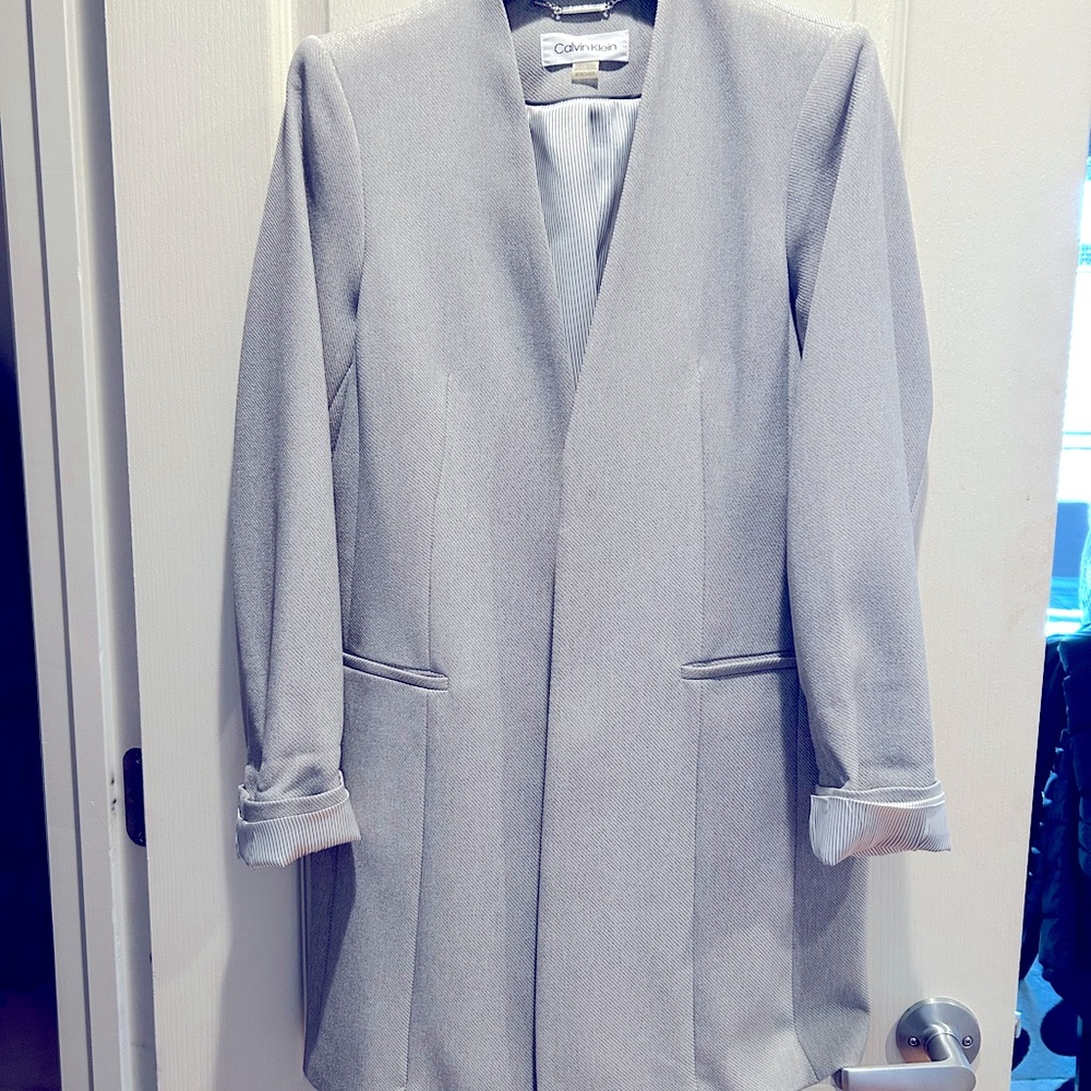 Calvin Klein long blazer light grey with silver pin striped lining. Size 8p